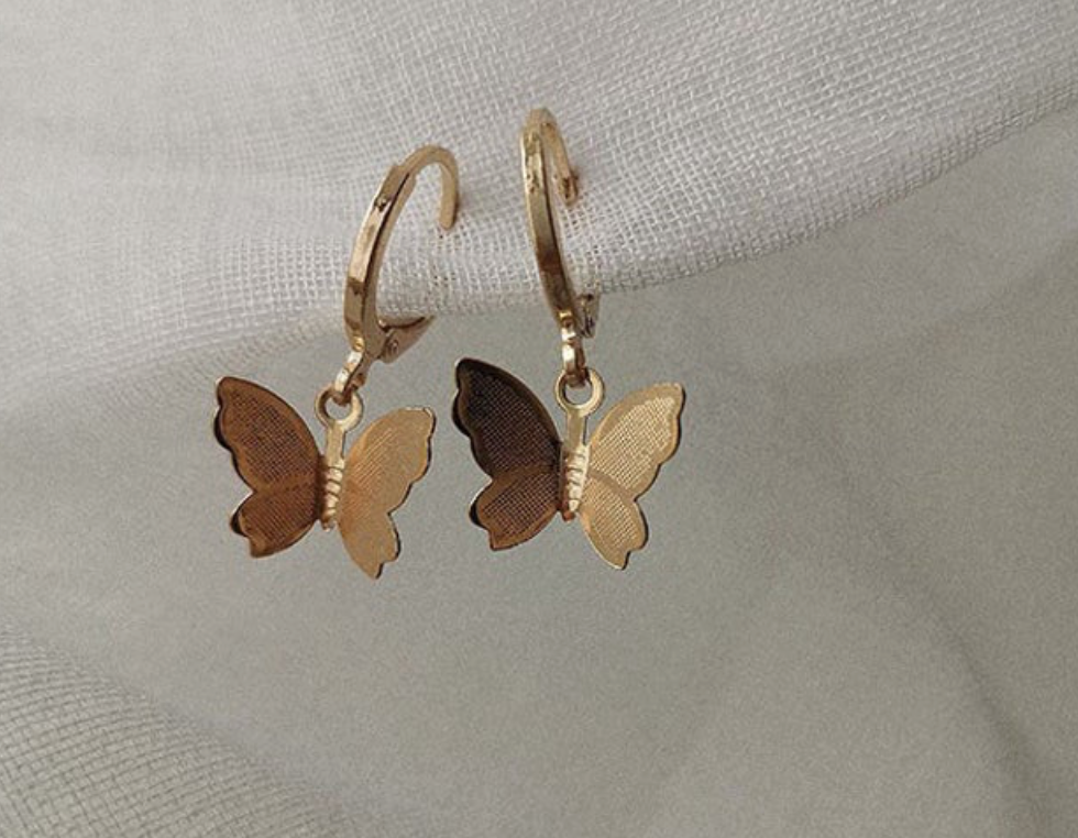 Gold Butterfly Huggy Hoop Earrings, our gold-plated Butterfly Huggy Hoop Earrings add a delicate, sparkling touch to any outfit. Their petite design 