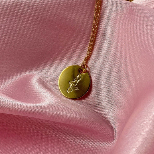 Gold Hand Stamped Mermaid Necklace, our tiny sweet mermaid is hand stamped on a gold disk with a 14k gold filled chain, it's adoring charm makes an endless treasure.
