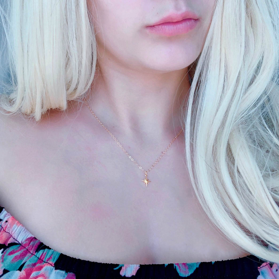 14K Gold North Star Charm Necklace, our eight-point North Star Charm Necklace has a tiny gold 8 point star charm on 14k gold-filled chain, it's a charming 